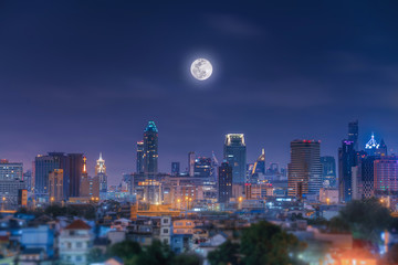 night view of the city of bangkok and moon