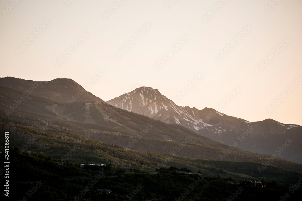 Wall mural sunset glow behind the mountains of colorado