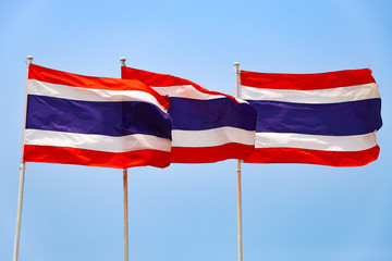 Three of the flag of Thailand on blue sky background.