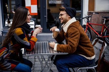 Coffee to go for two friendly people in street cafe stock photo