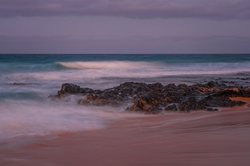 Long exposure view of Playa del Dormidero Beach or Playa El Viejo, located at Grandes Playas Corralejo - Fuerteventura, Canary Islands, Spain. October 2019