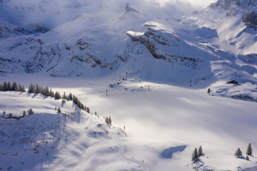 Fototapeta na wymiar Wonderful snowy winter landscape in the Alps - aerial shot