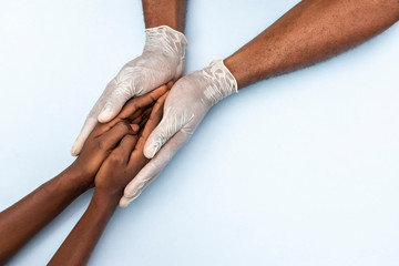 african doctor holding a patient, giving instructions and support