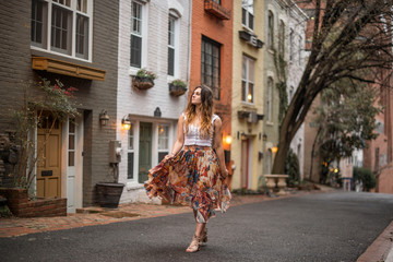 female traveler walking the colorful streets of downtown georgetown in washington DC - obrazy, fototapety, plakaty