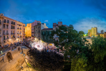 Tarragona, Spain, 09 22 2018: St. Thecla's feast in the evening square with fireworks