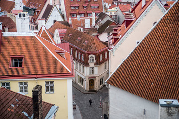 Fototapeta na wymiar aerial view of lone traveler on the old streets of tallinn estonia 