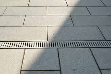granite rain gutter, rainwater runs in the canal
