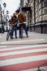 Couple of cyclers kissing on the pavement stock photo