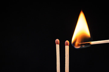 Burning flame to a matchstick