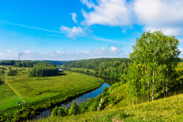 Fototapeta na wymiar river and forest from a high hill on a summer day