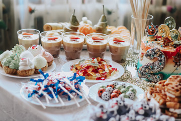 Children's table catering. Sweets: waffles, sweets, cake, chocolate.