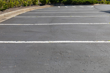 Lined and empty asphalt parking lot, horizontal aspect