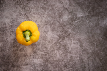 Yellow Bell Pepper on a Black Cement Background