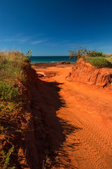 Fototapeta na wymiar Western Australia – Outback sand track for 4WD car downhill to the ocean at Dampier Peninsula