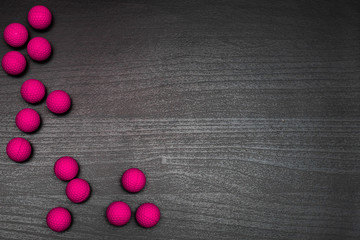 Colorful balls on dark wooden table