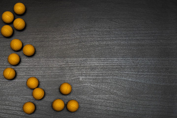 Fototapeta na wymiar Colorful balls on dark wooden table