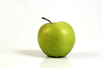 sliced red and green apple on white ground 