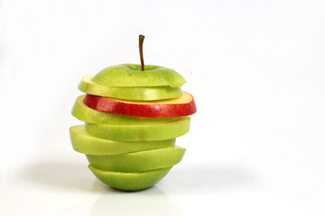 sliced red and green apple on white ground 