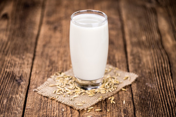 Portion of fresh Oat Milk (selective focus; close-up shot)