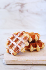 Traditional belgian waffles, powdered sugar dressing