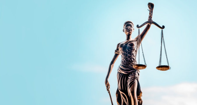 Legal law concept image, Scales of Justice on blue background 