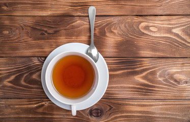 Flatley with a Cup of tea on a brown vintage background.