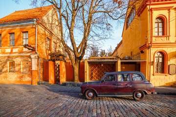 A car parked on an old European street