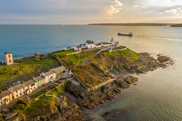 Amazing view aerial drone Irish Coastal Coastline Roches Point Lighthouse  - obrazy, fototapety, plakaty