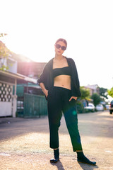 Portrait of young beautiful woman in the city streets outdoors