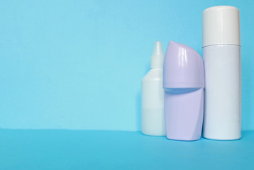White bottle with Body antiperspirant deodorant roll-on on blue background.