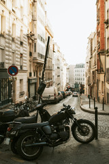 Fototapeta na wymiar Parked motorbikes on a sidewalk in Rome