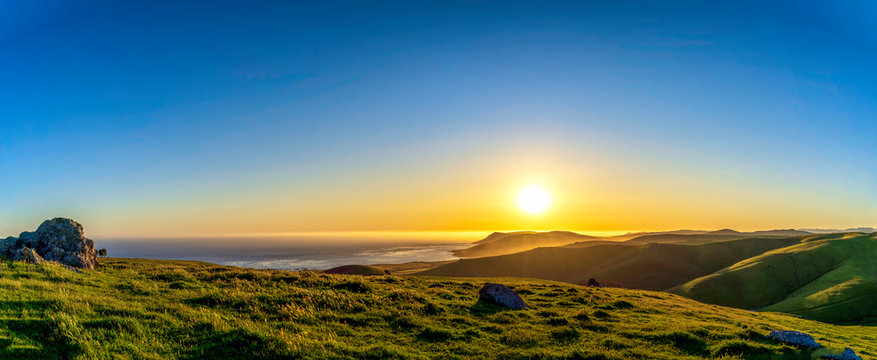 Panorama of Sunset over Mountains, Ocean, Hills