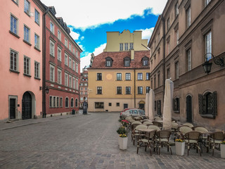 Warsaw Old Town. Empty streets without tourists. Cozy old European courtyard, paved with paving stones.