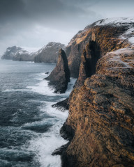 Waves crashing against the Slave cliff