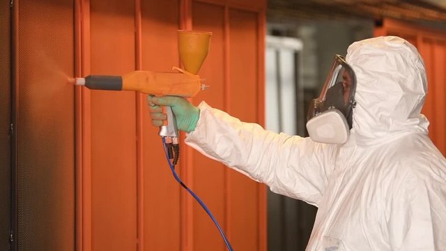 polymer coating of metal detail with powder spraying gun