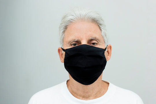 portrait of senior man wearing mask in pandemic time