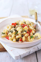 Italian pasta fusilli salad with tuna, bell pepper and cappers