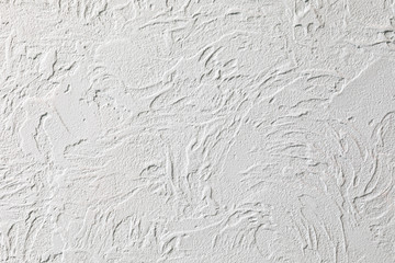 The background of the raised white wall is finished with decorative plaster. Abstract streaks like...