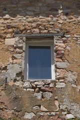 old window in stone wall