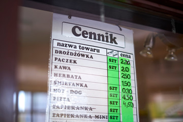 Obraz premium Price list in a little school shop in Poland.