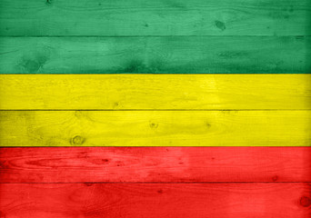 Wooden surface texture background in rasta colors