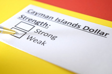 Fototapeta premium One person is answering question about strength of Cayman Islands Dollar.