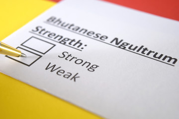 One person is answering question about strength of Bhutanese Ngultrum currency.