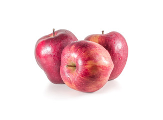 A set of three fresh red apples with drops isolated on white background