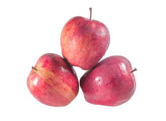 Obraz premium A set of top view of three fresh red apples with drops isolated on white background