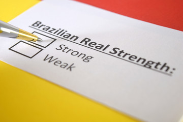 One person is answering question about strength of Brazilian Real Currency.