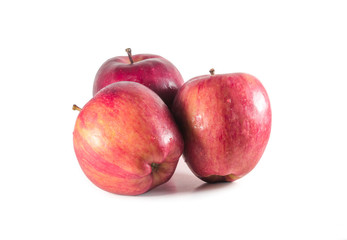 A set of three fresh red apples with drops isolated on white background