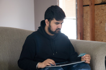 young man using a tablet computer