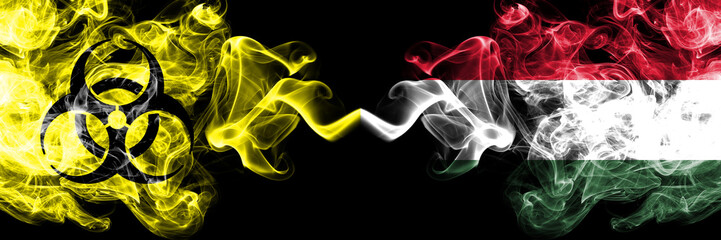 Quarantine in Hungary, Hungarian. Coronavirus COVID-19 lockdown. Smoky mystic flag of Hungary, Hungarian with biohazard symbol placed side by side.