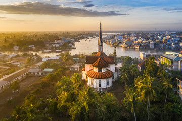 Aerial view of the famous Cai Be church in the Mekong Delta, Roman architectural style. In front is...